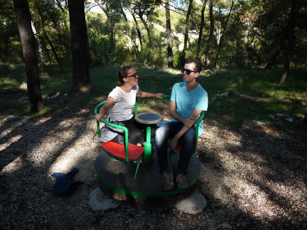 We found a playground near the trail and had to stop to enjoy it. Gary took this photo of us on a spinning disc. I think this is at about the point we wished we weren't spinning anymore.