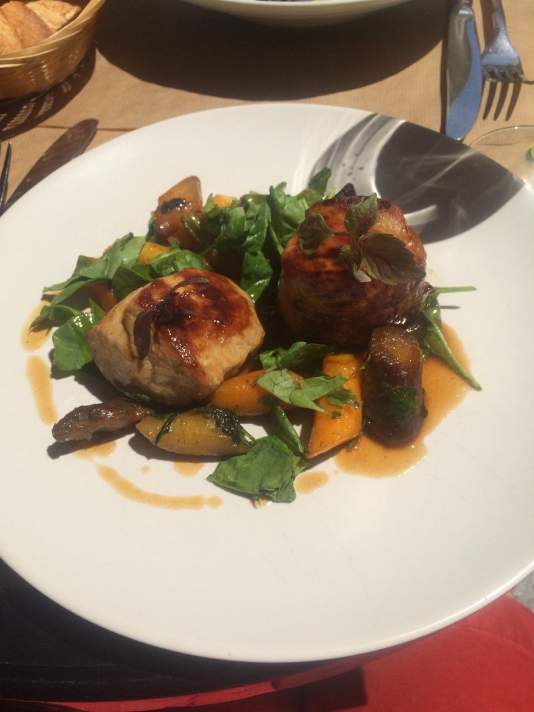 plate of pork, carrots, and greens