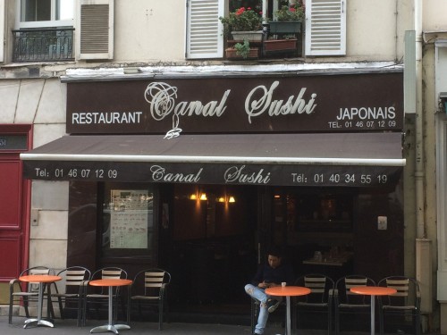 Sign for restaurant named canal sushi.