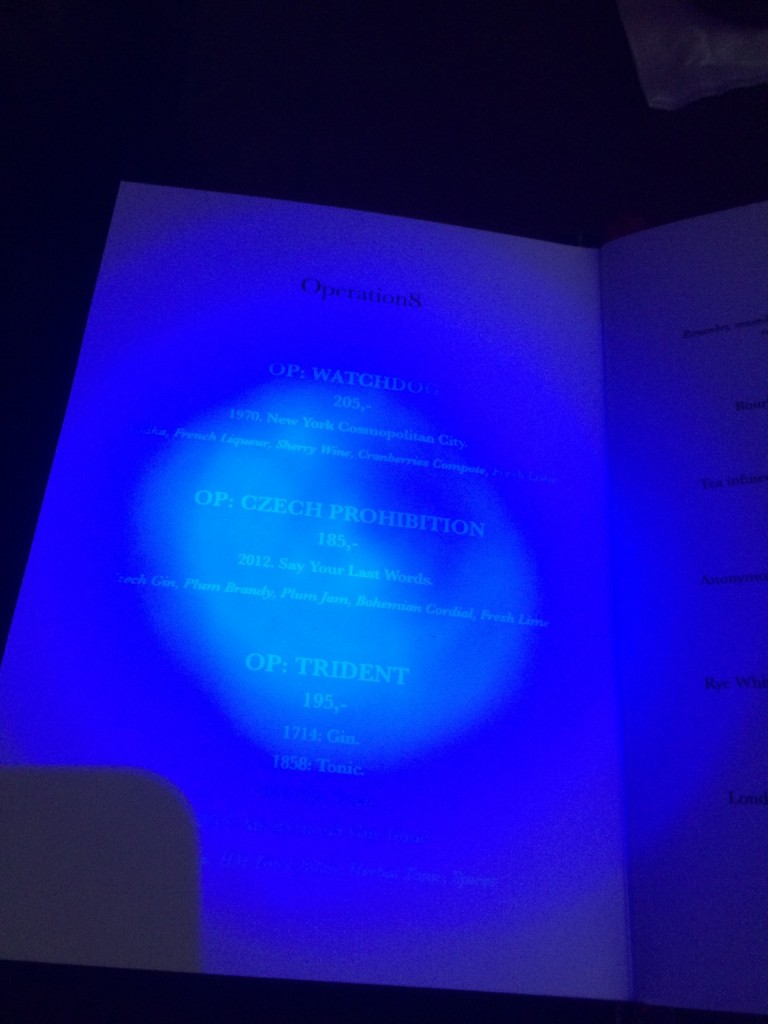 Invisible ink menu at anonymous bar in Prague read by blacklight