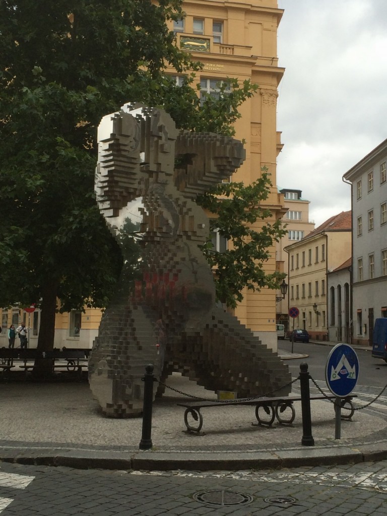 Giant pixelated statue of pregnant woman in Prague