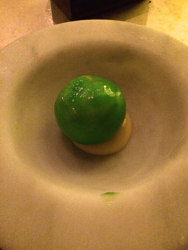 12th course: Lime ice cream and yuzu foam inside a green apple candy shell, served on lemon curd.  We love all those things!