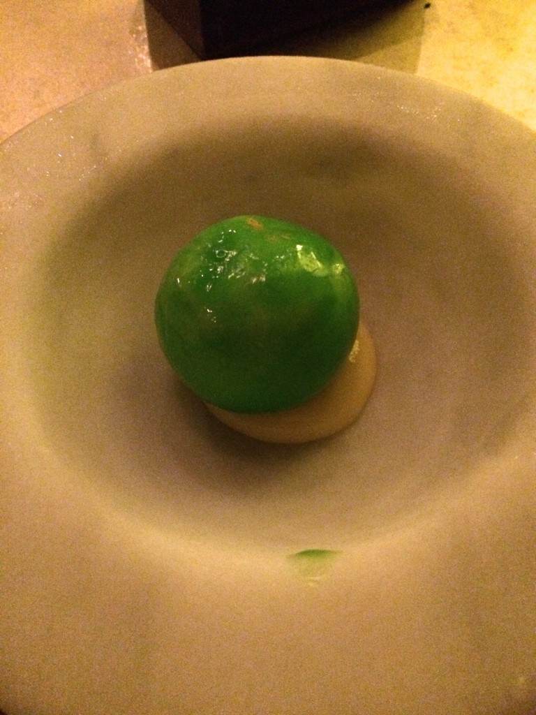 12th course: Lime ice cream and yuzu foam inside a green apple candy shell, served on lemon curd. We love all those things!